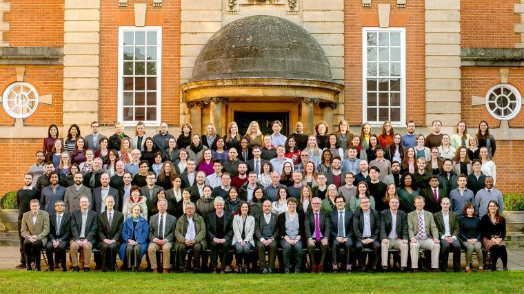 Photograph of staff in the Nuffield Department of Surgical Sciences taken outside Lady Margaret Hall, Oxford