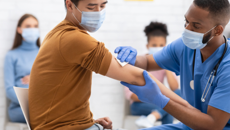 Patient being given a vaccination by a healthcare professional