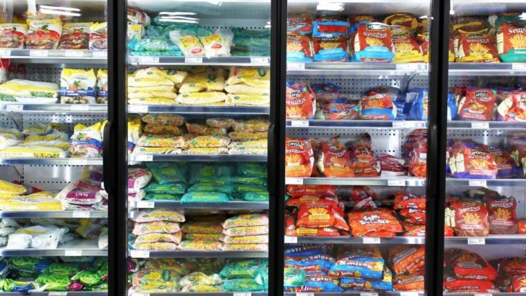Supermarket shelves containing frozen food items