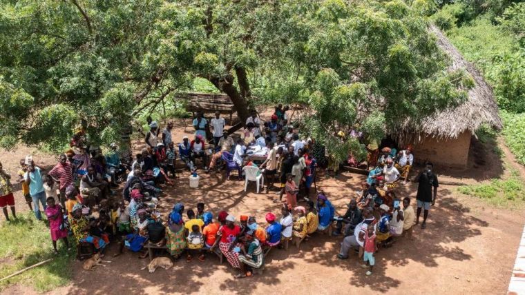 Large group of people in circle waiting for vaccination in Sierra Leona