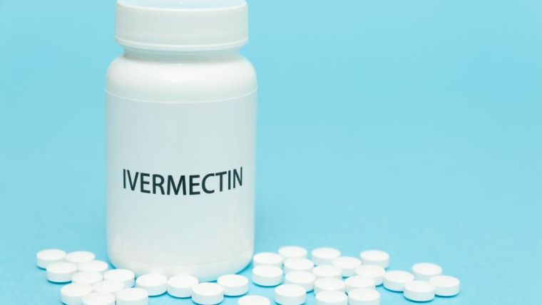 A bottle of white tablets with the word ivermectin written on the label.
