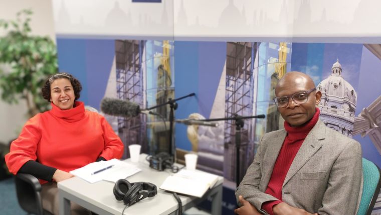A photo of Proochista Ariana and Caesar Atuire in the podcast recording room, recording the IHTM podcast series.