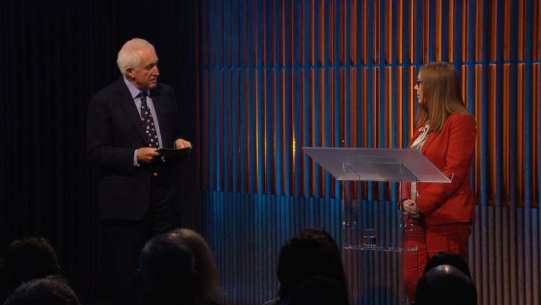 David Dimbleby and Prof. Dame Sarah Gilbert on stage at the 44th Dimbleby Lecture
