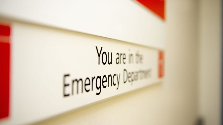 Wall mounted signboard with the information: you are in the emergency department.